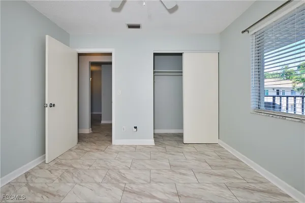 a view of an empty room with a window