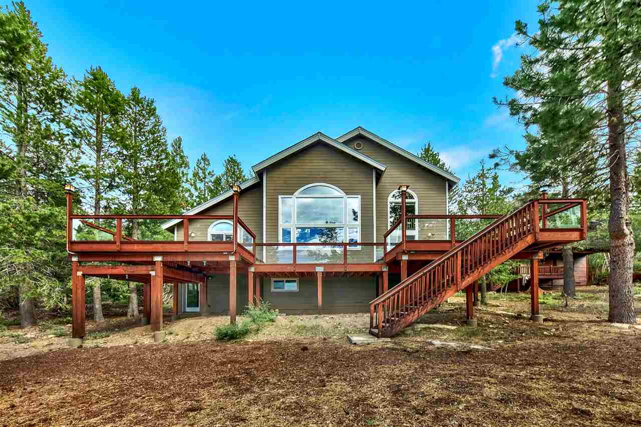 12464 Snowpeak Way Truckee, CA 96161 - Photo 3 of 21 a view of a house with a small yard and large trees