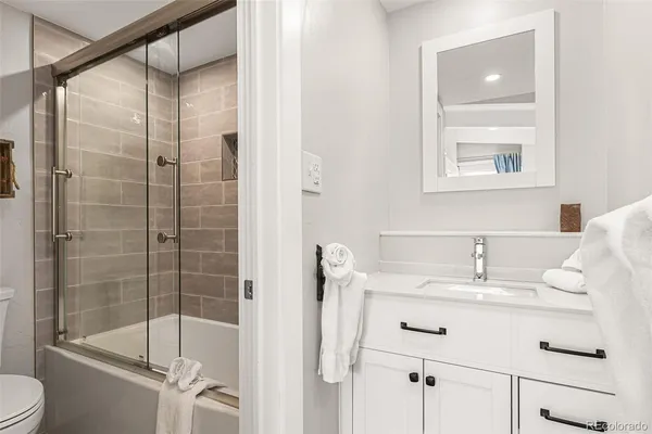 a bathroom with a shower and a toilet