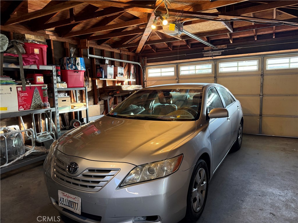 13116 Weidner Street Pacoima, CA 91331 - Photo 17 of 21 a car parked in a garage