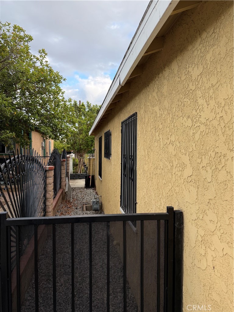 13116 Weidner Street Pacoima, CA 91331 - Photo 4 of 21 a view of a house with wooden fence