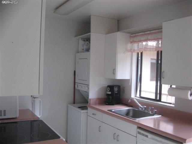 2219 South Kihei Road, Unit B316 Kihei, HI 96753 - Photo 2 of 5 a kitchen with a sink and cabinets