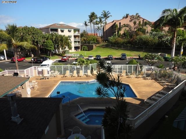 2219 South Kihei Road, Unit B316 Kihei, HI 96753 - Photo 5 of 5 a view of a swimming pool with outdoor seating and plants