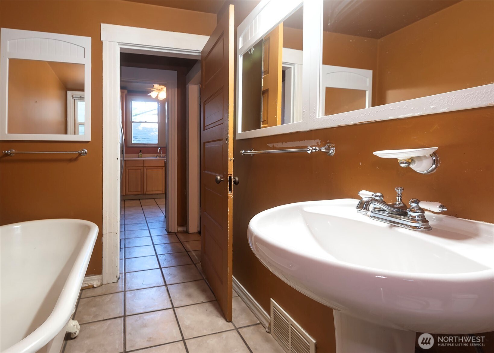 2214 North 60th Street Seattle, WA 98103 - Photo 11 of 22 a bathroom with a sink and mirror