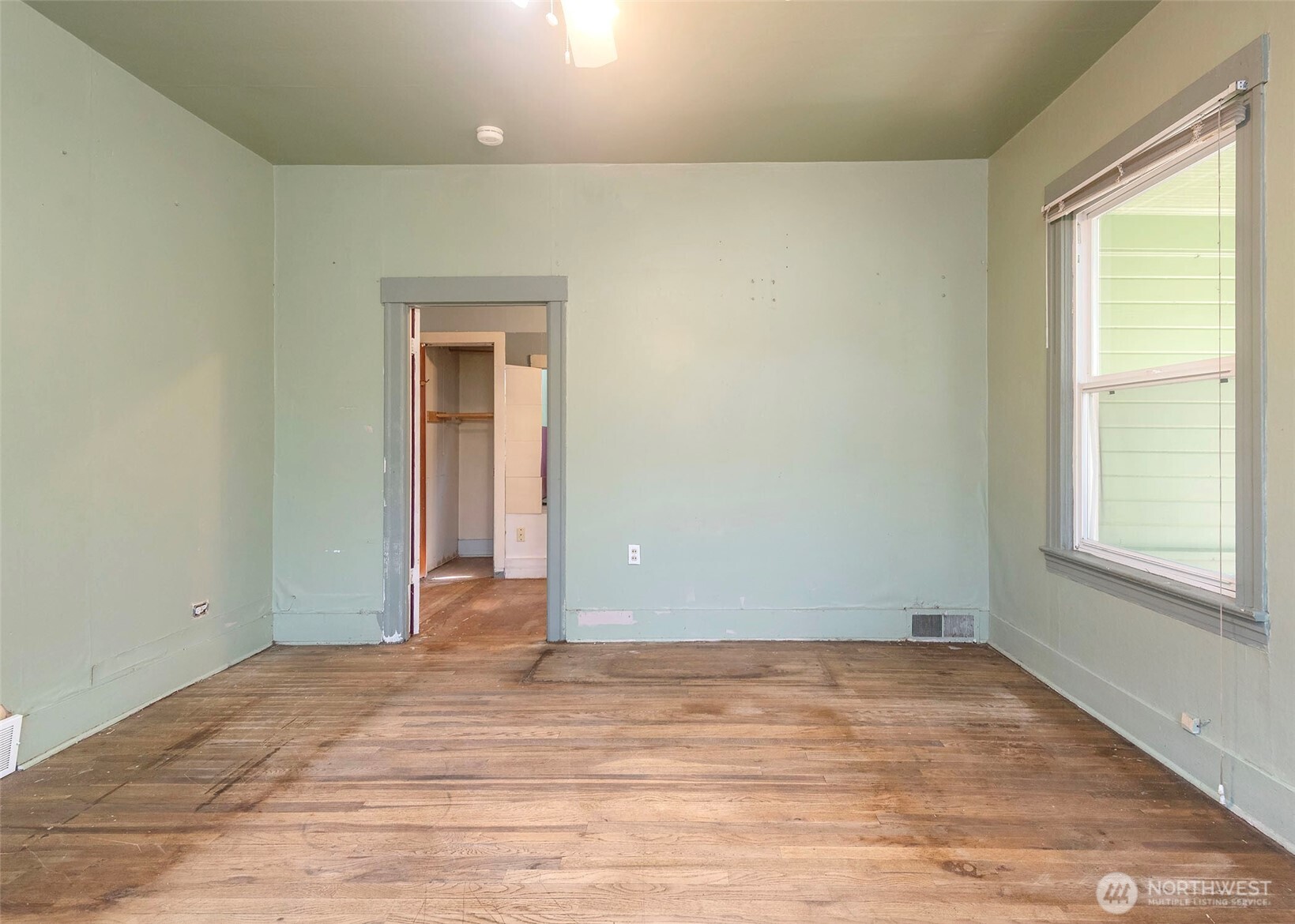 2214 North 60th Street Seattle, WA 98103 - Photo 14 of 22 a view of a room with wooden floor and a window