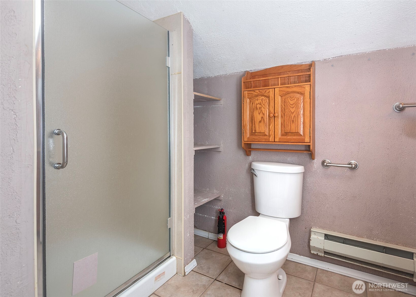 2214 North 60th Street Seattle, WA 98103 - Photo 17 of 22 a white toilet sitting next to a bathroom sink