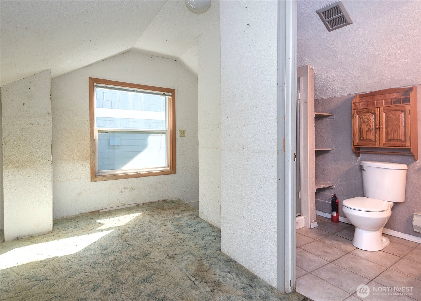 2214 North 60th Street Seattle, WA 98103 - Photo 19 of 22 a bathroom with a toilet