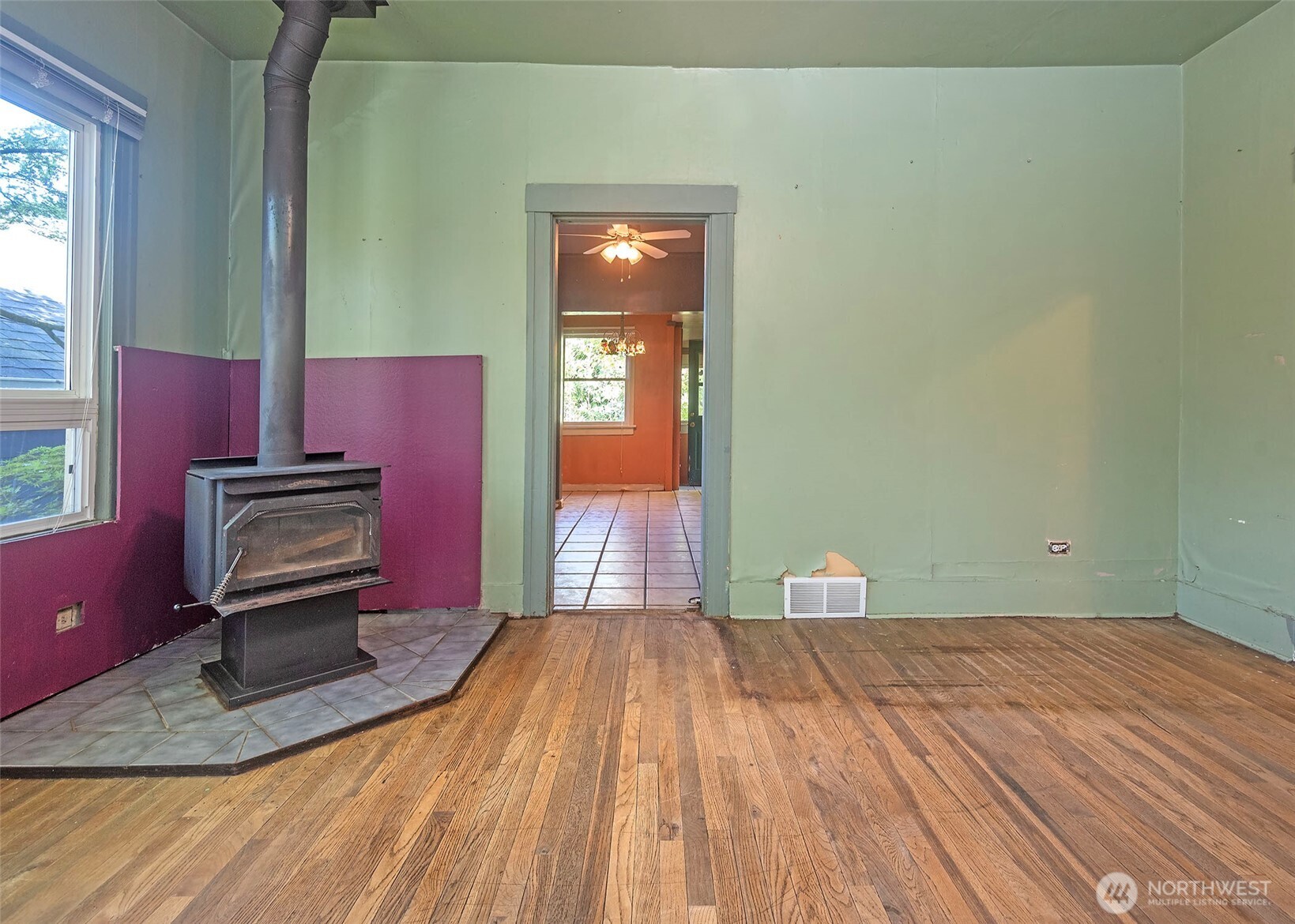 2214 North 60th Street Seattle, WA 98103 - Photo 3 of 22 a view of a livingroom with wooden floor and furniture