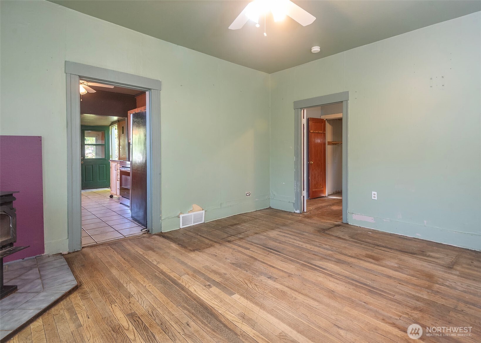 2214 North 60th Street Seattle, WA 98103 - Photo 5 of 22 a bedroom with a bed and a mirror
