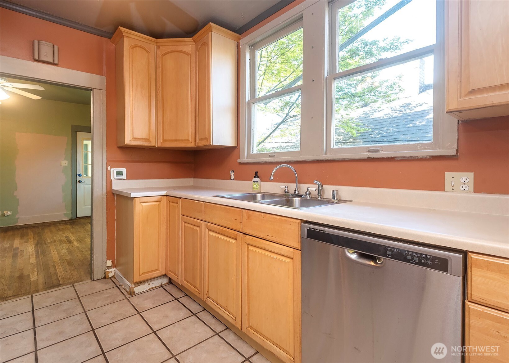 2214 North 60th Street Seattle, WA 98103 - Photo 7 of 22 a kitchen with a sink window and cabinets