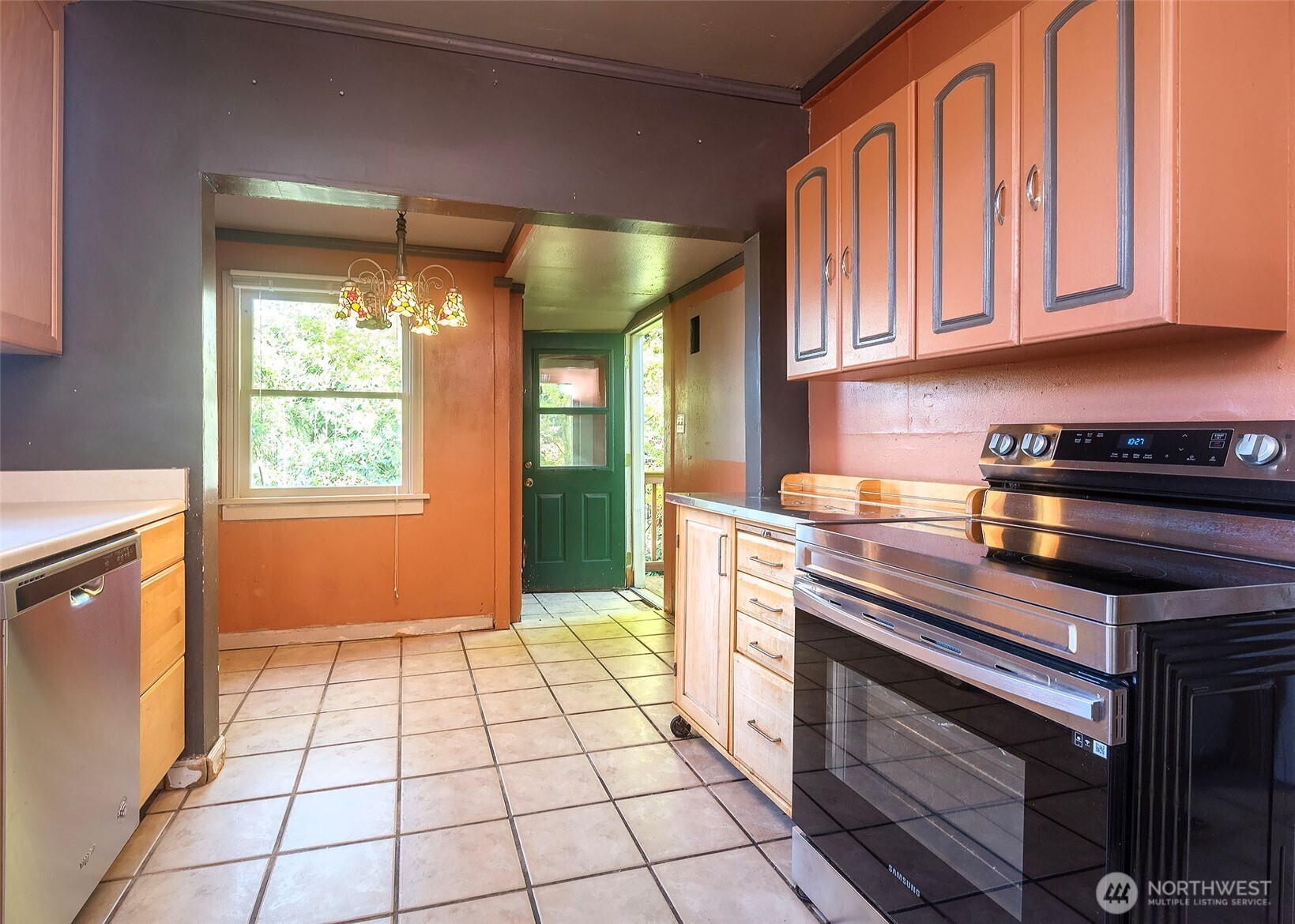 2214 North 60th Street Seattle, WA 98103 - Photo 8 of 22 a kitchen with a stove a fridge and a sink