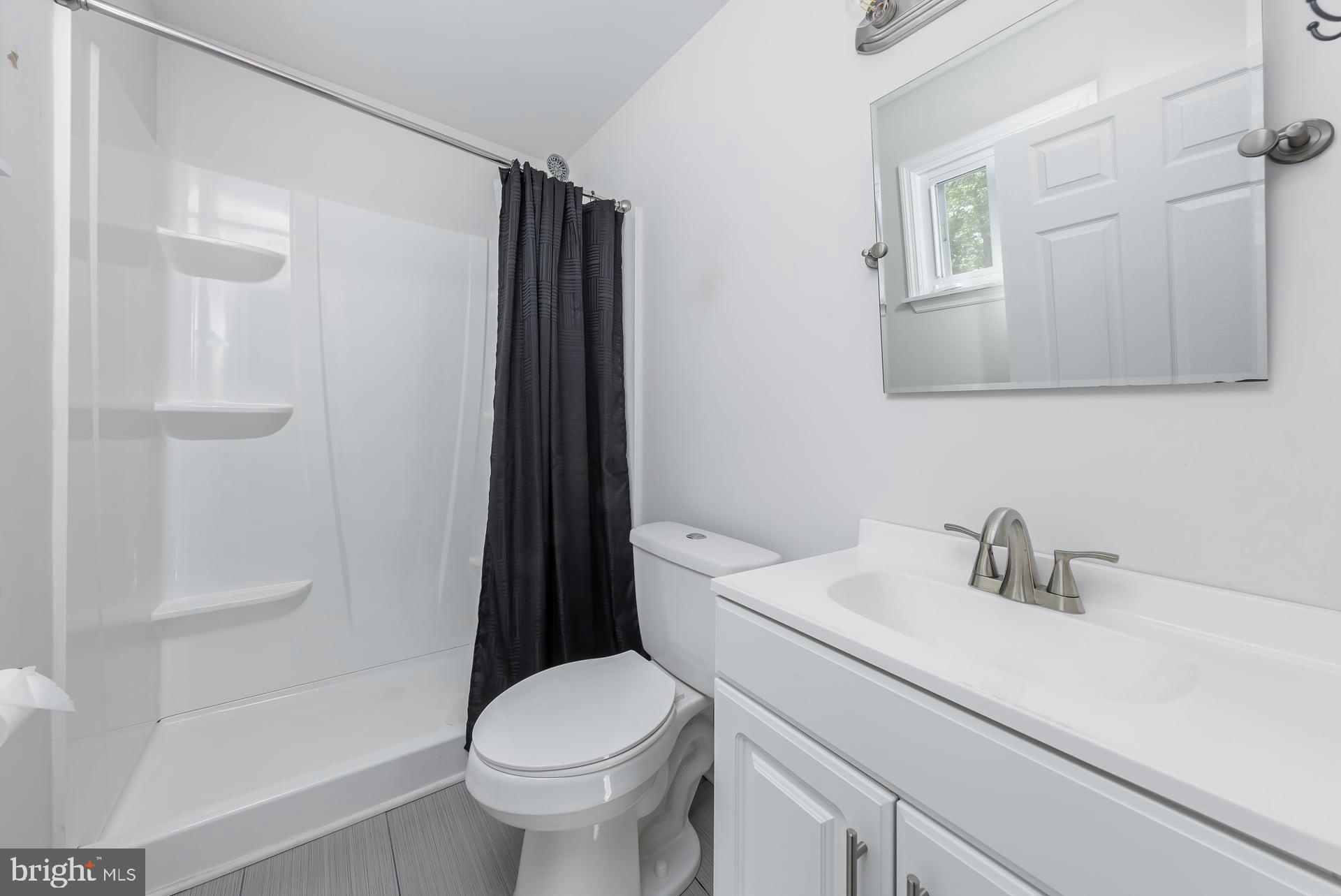 1203 Cedar Drive Pine Hill, NJ 08021 - Photo 14 of 19 a bathroom with a sink toilet and shower