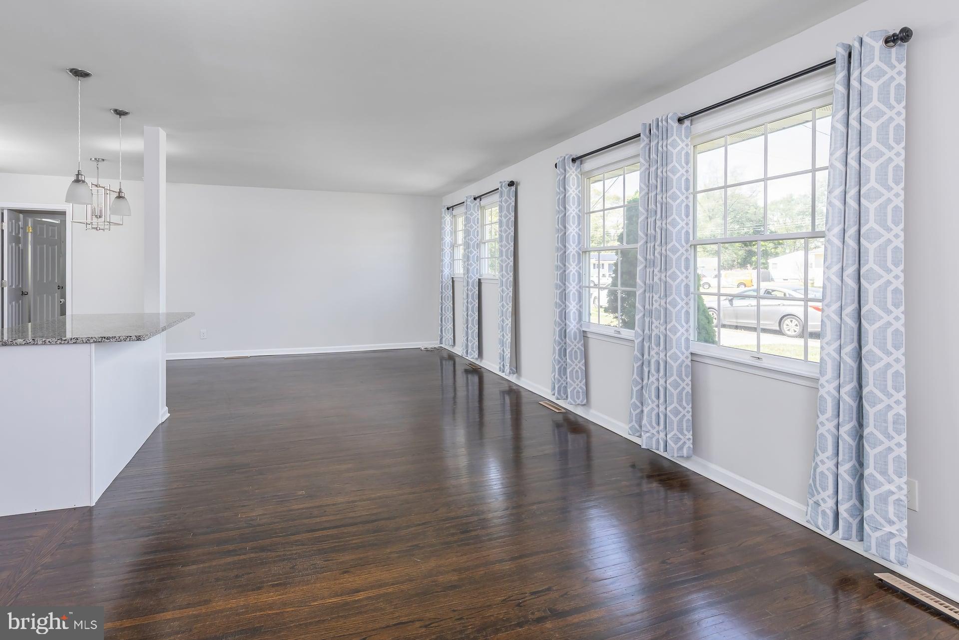 1203 Cedar Drive Pine Hill, NJ 08021 - Photo 9 of 19 wooden floor in an empty room with a window
