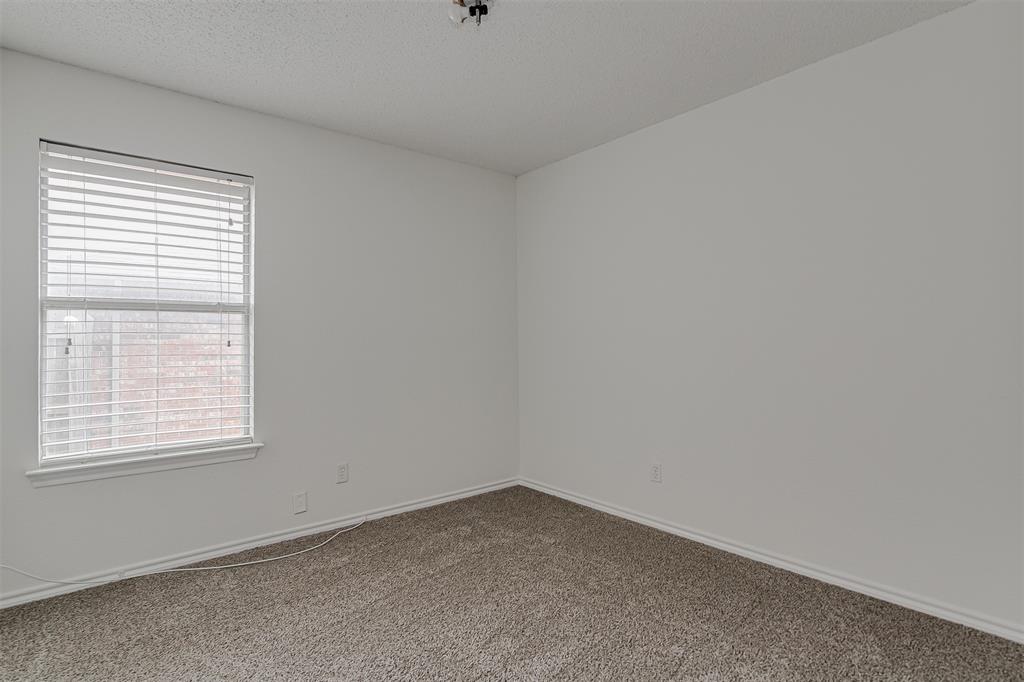 606 McAnear Street Cleburne, TX 76033 - Photo 16 of 19 an empty room with a window