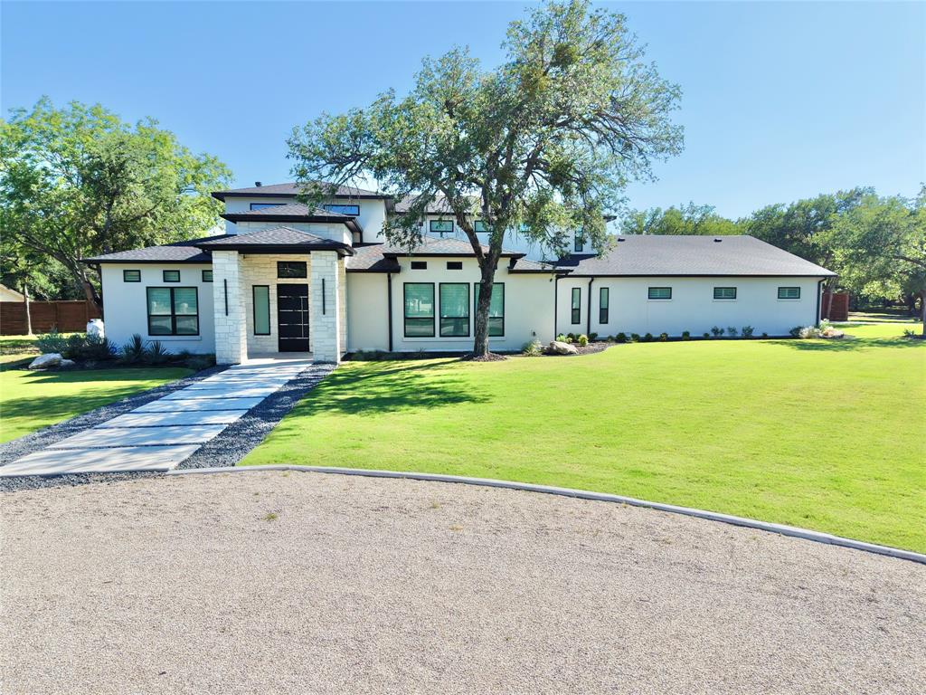 428 Squaw Creek Road Willow Park, TX 76087 - Photo 6 of 34 a front view of a house with a yard and trees