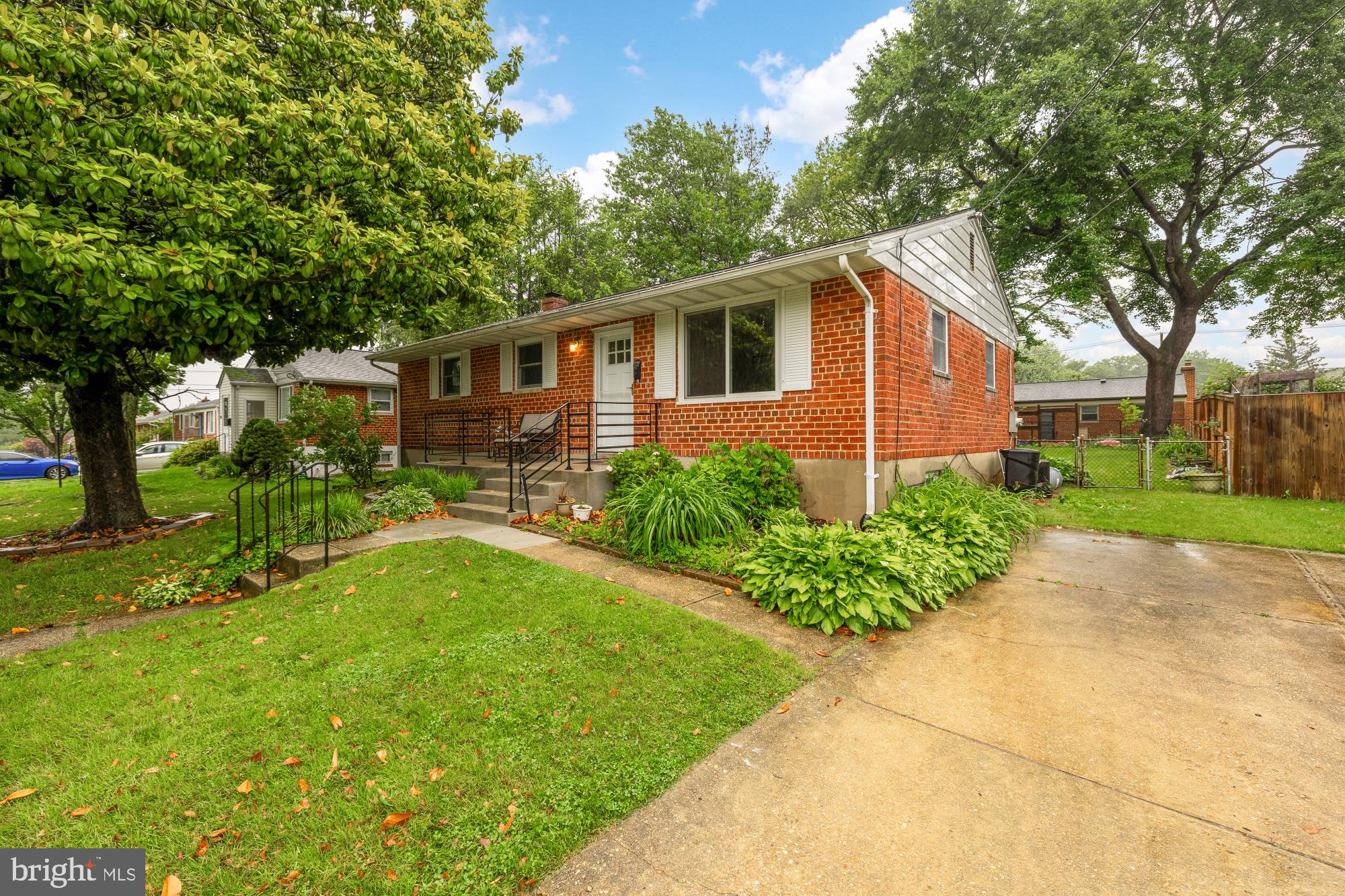 909 Snure Road Silver Spring, MD 20901 - Photo 2 of 3 a front view of house with yard and green space