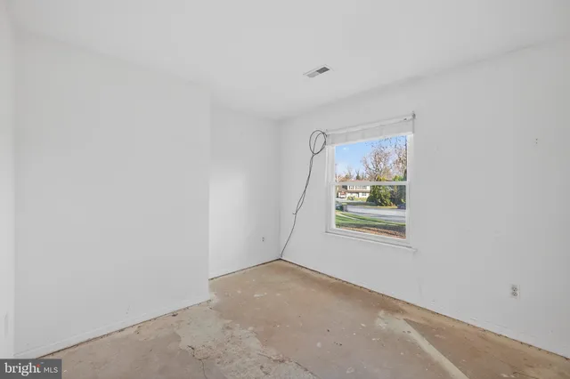 an empty room with windows