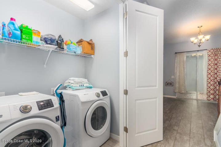 3465 Sedge Drive Rockledge, FL 32955 - Photo 10 of 12 a utility room with dryer and washer