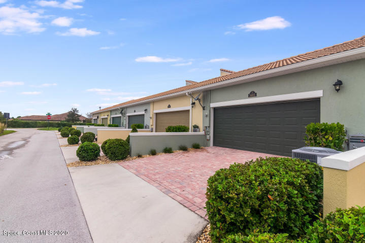 3465 Sedge Drive Rockledge, FL 32955 - Photo 2 of 12 a front view of a house with garden