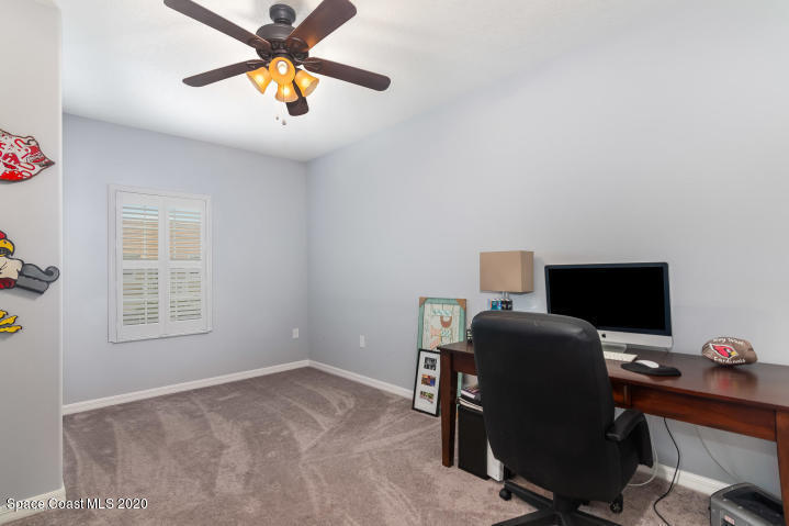 3465 Sedge Drive Rockledge, FL 32955 - Photo 9 of 12 a view of a workspace with furniture and a window