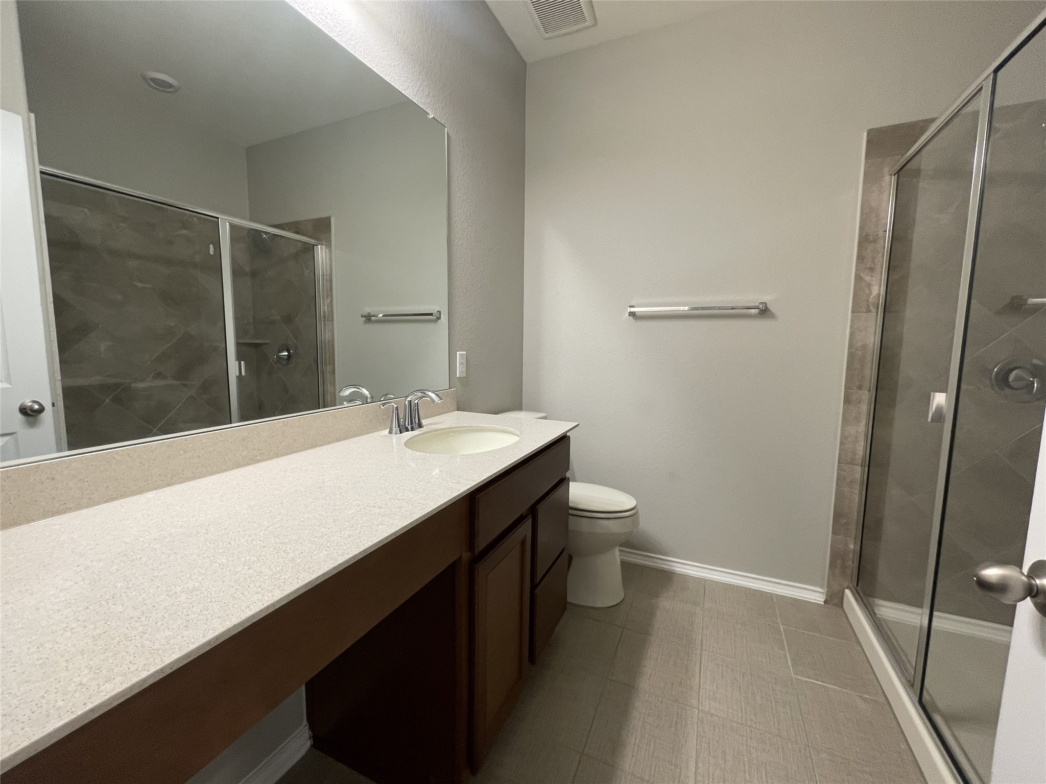 2471 Sunrise Road, Unit 62 Round Rock, TX 78664 - Photo 23 of 28 Bathroom featuring vanity and a shower stall