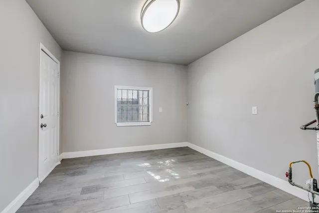 a view of empty room with windows