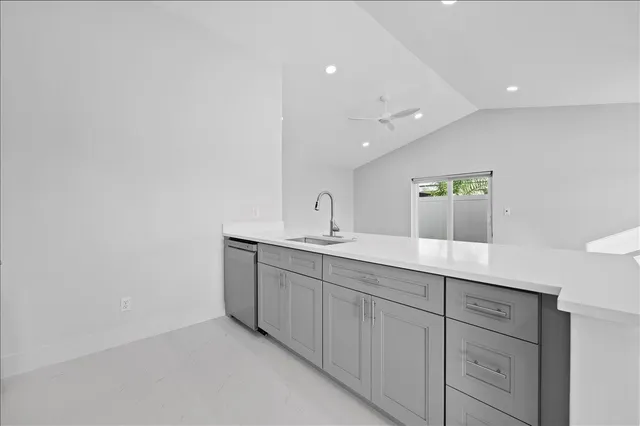a bathroom with a double vanity sink and mirror