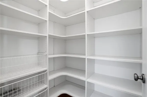 a view of an empty room with glass door