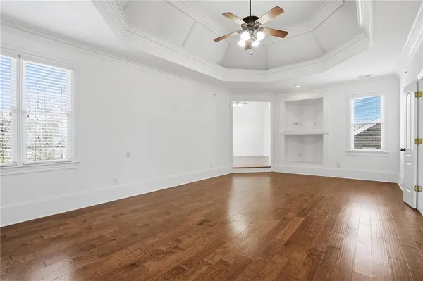a bathroom with a sink toilet vanity and shower