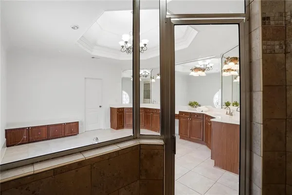 a view of a blue house with large windows