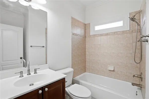 an aerial view of a swimming pool with outdoor seating