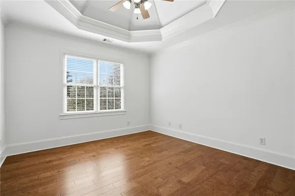 a view of a two chairs in the park