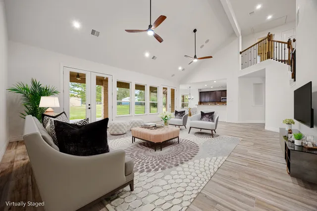 a living room with furniture fireplace and flat screen tv