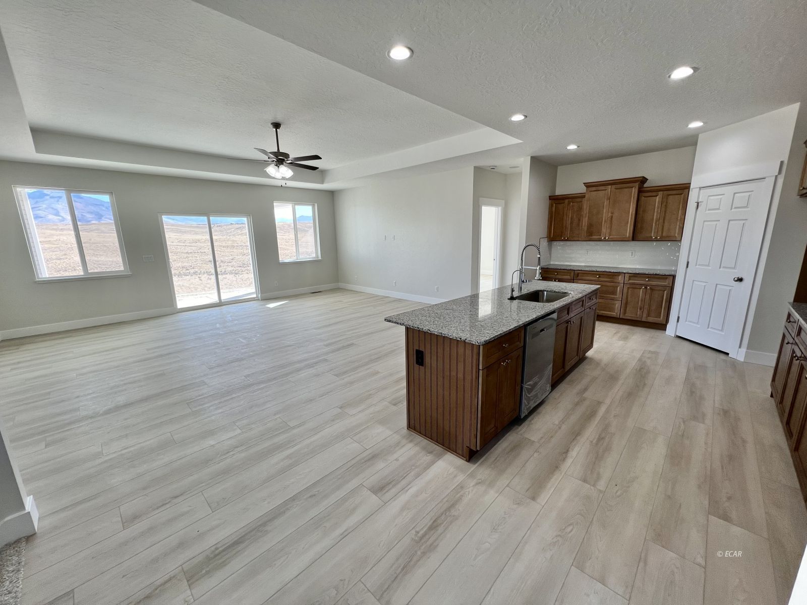 518 Ridgeway Drive Spring Creek, NV 89815 - Photo 9 of 37 a large kitchen with stainless steel appliances granite countertop a large counter top a wooden floors and a large window