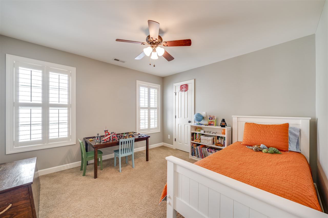 401 Rensford Place Cary, NC 27513 - Photo 20 of 30 Bedroom with ceiling fan & walk in customized closet! Bedroom