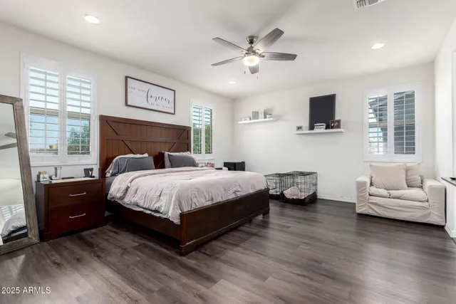 a spacious bedroom with a bed and a couch