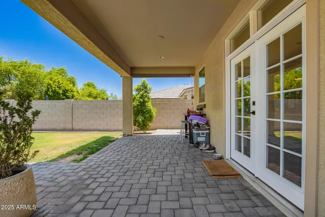 a view of a porch with wooden floor and a potted plant