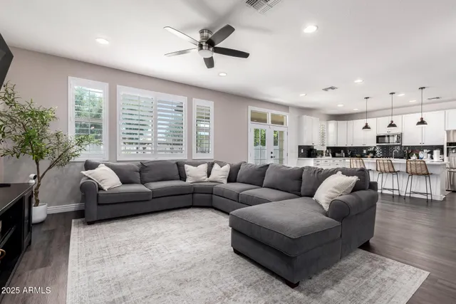 a living room with furniture and a large window