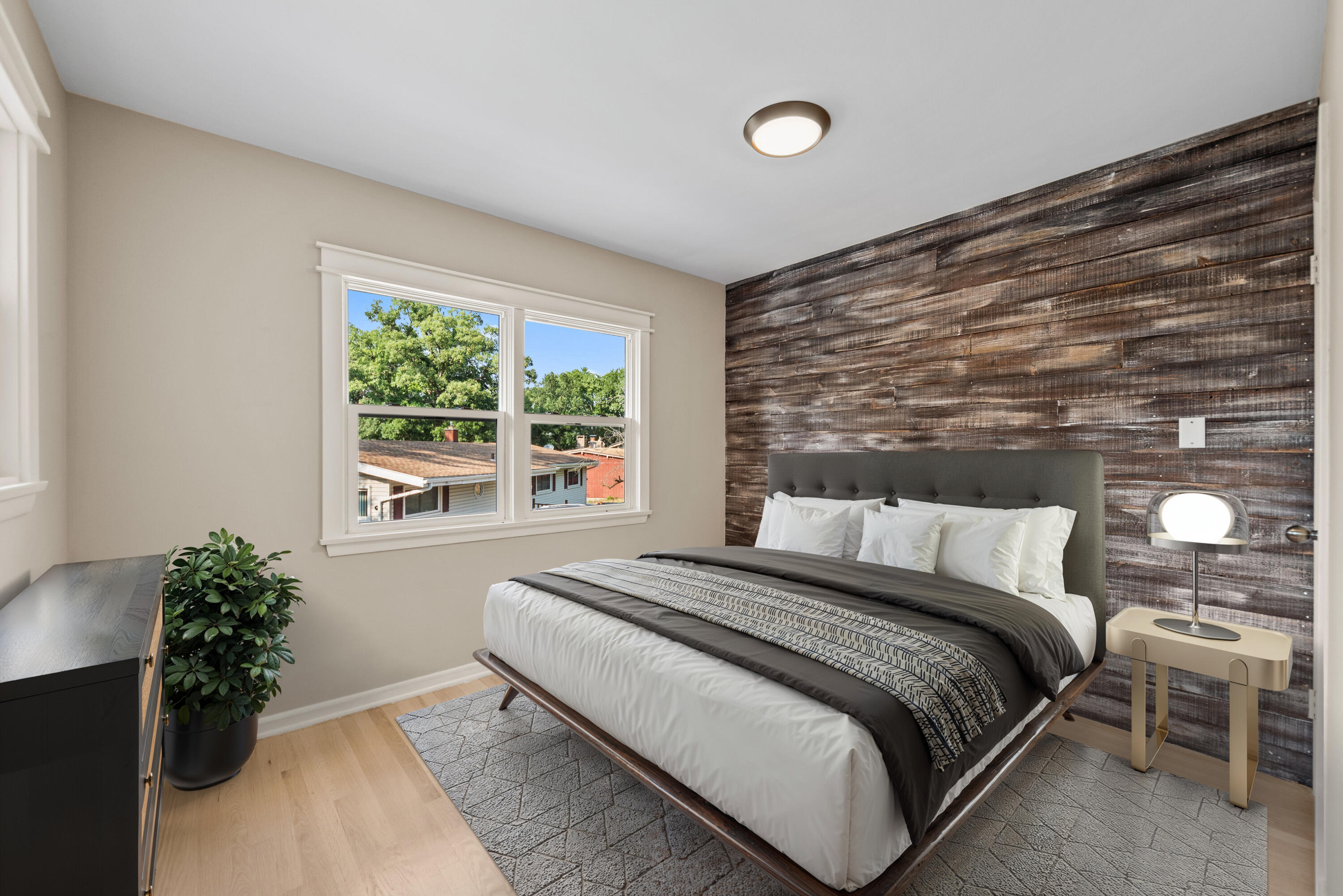 9176 West Springhill Drive St. John, IN 46373 - Photo 12 of 20 a bedroom with a bed and a potted plant