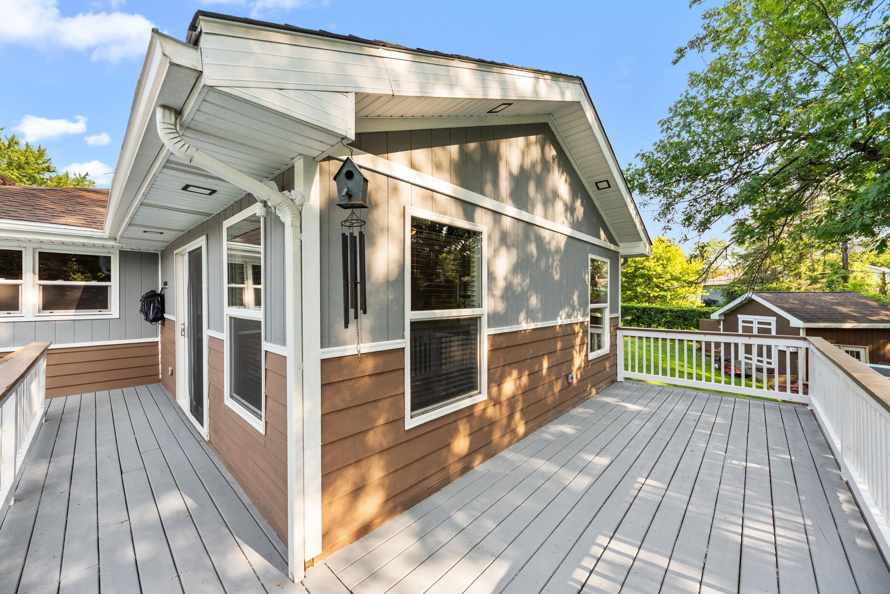 9176 West Springhill Drive St. John, IN 46373 - Photo 17 of 20 a view of a balcony with wooden floor and fence