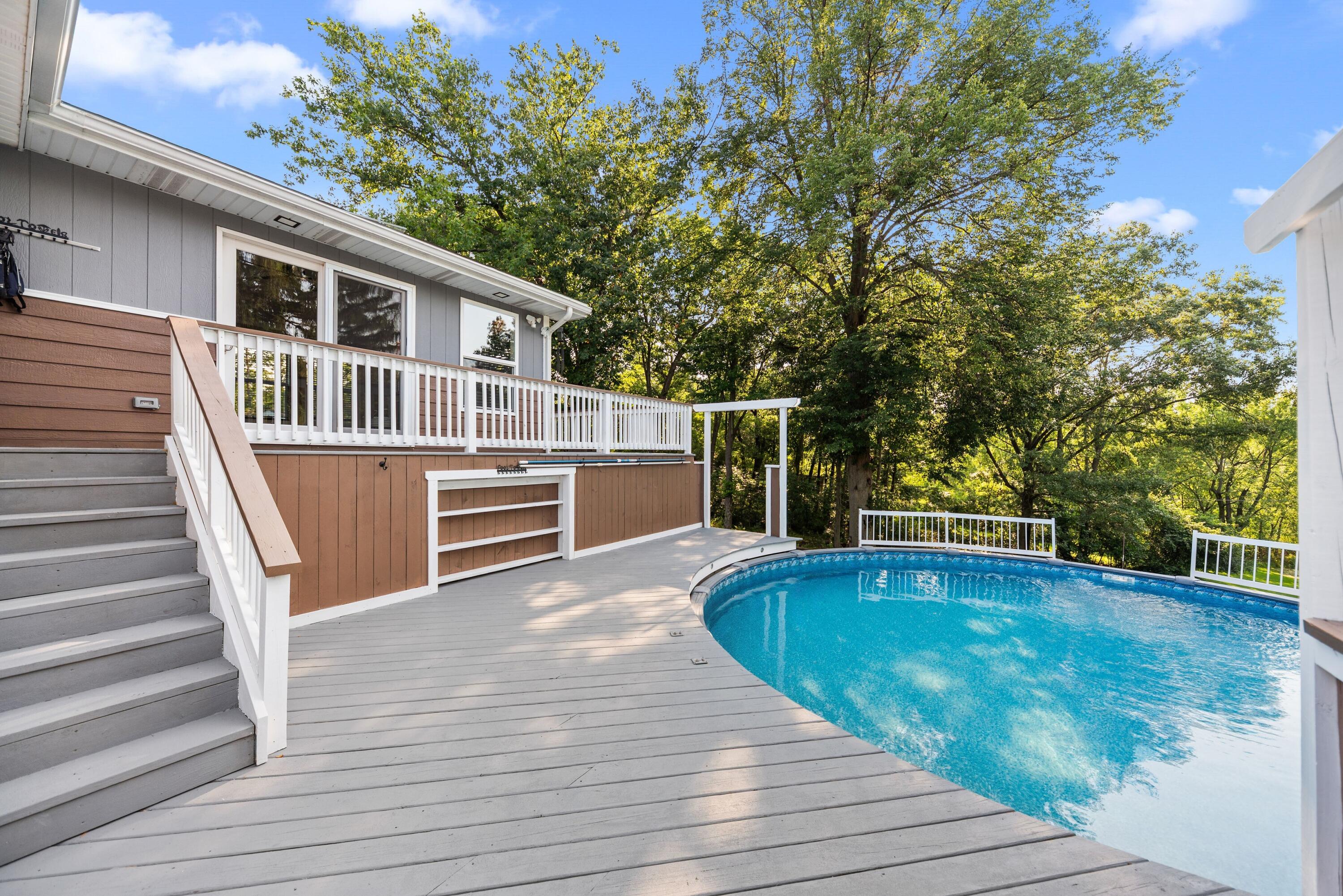 9176 West Springhill Drive St. John, IN 46373 - Photo 18 of 20 a view of house with swimming pool and deck