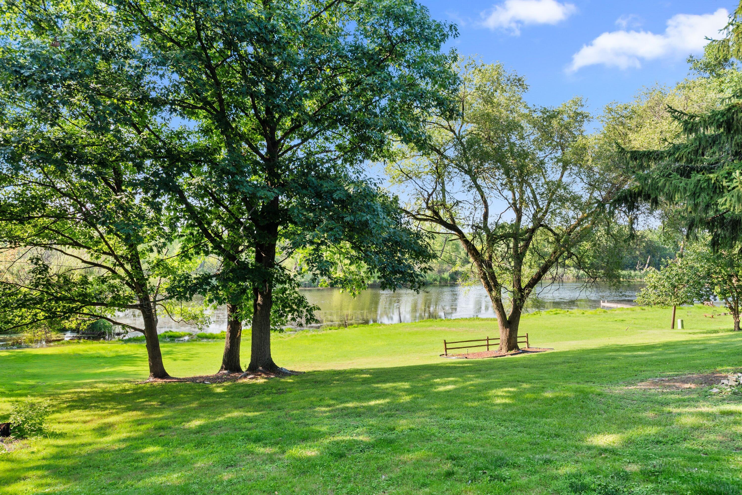 9176 West Springhill Drive St. John, IN 46373 - Photo 19 of 20 a view of green field with a tree in the background