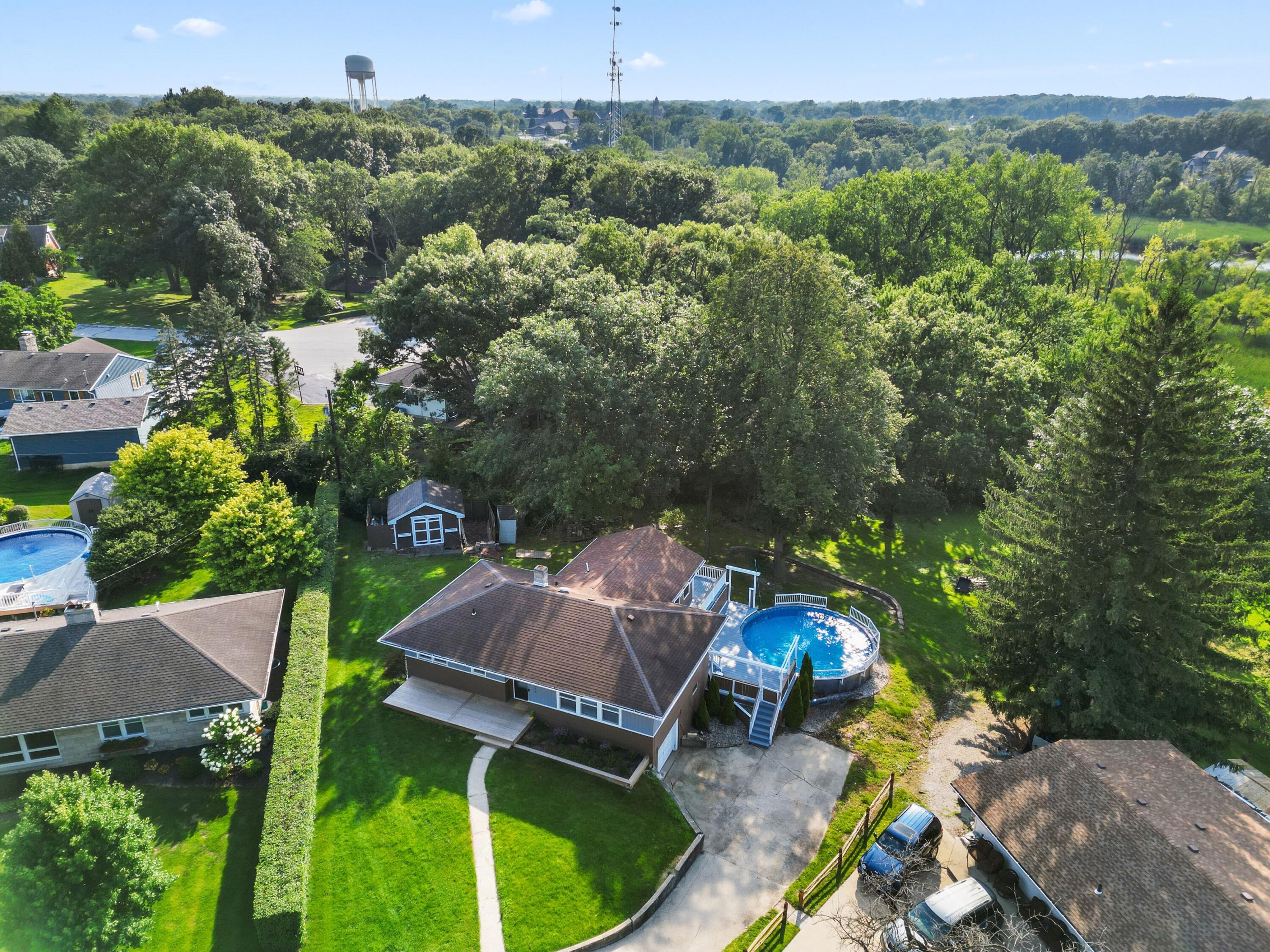9176 West Springhill Drive St. John, IN 46373 - Photo 2 of 20 an aerial view of a house with yard swimming pool and outdoor seating