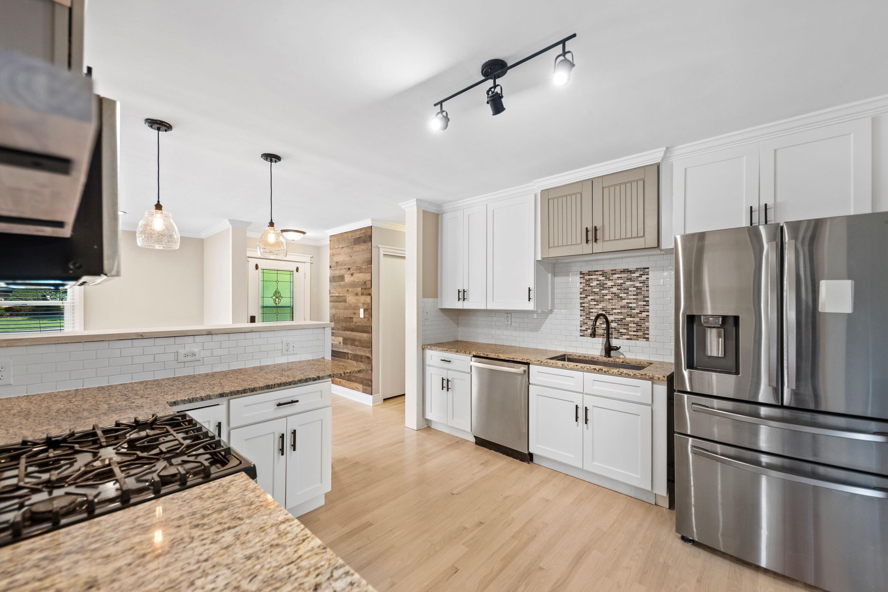 9176 West Springhill Drive St. John, IN 46373 - Photo 5 of 20 a kitchen with stainless steel appliances a refrigerator sink and stove