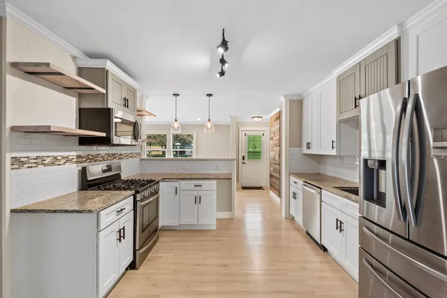 a bedroom with bed and a window