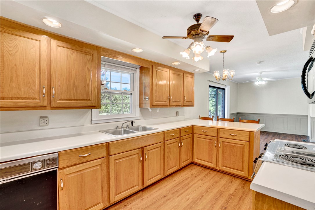 7876 Highway 11 Walhalla, SC 29691 - Photo 15 of 35 A well-equipped kitchen offers ample cabinet storage and an open view to the adjacent dining area.
