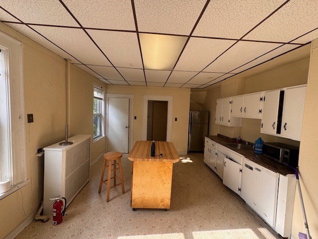 23 Lancaster Street Worcester, MA 01609 - Photo 2 of 3 a hallway with a car parked in it