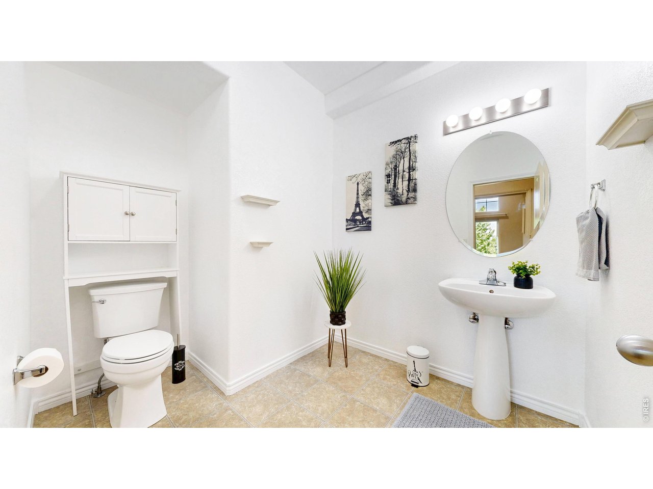 4672 West 20th Road, Unit 413 Greeley, CO 80634 - Photo 17 of 37 a bathroom with a toilet a sink and mirror