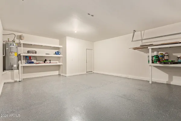 a view of an empty room with cabinet