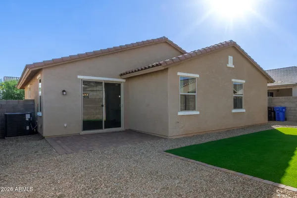 a backyard of a house with garage